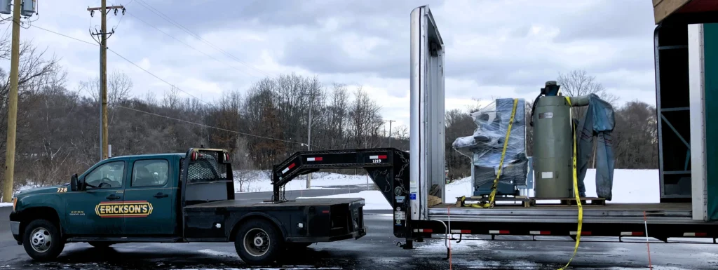 Erickson's volunteers their time and expertise to help move Micron's donation of a dusk collector and industrial grinder to the Harmel Campus