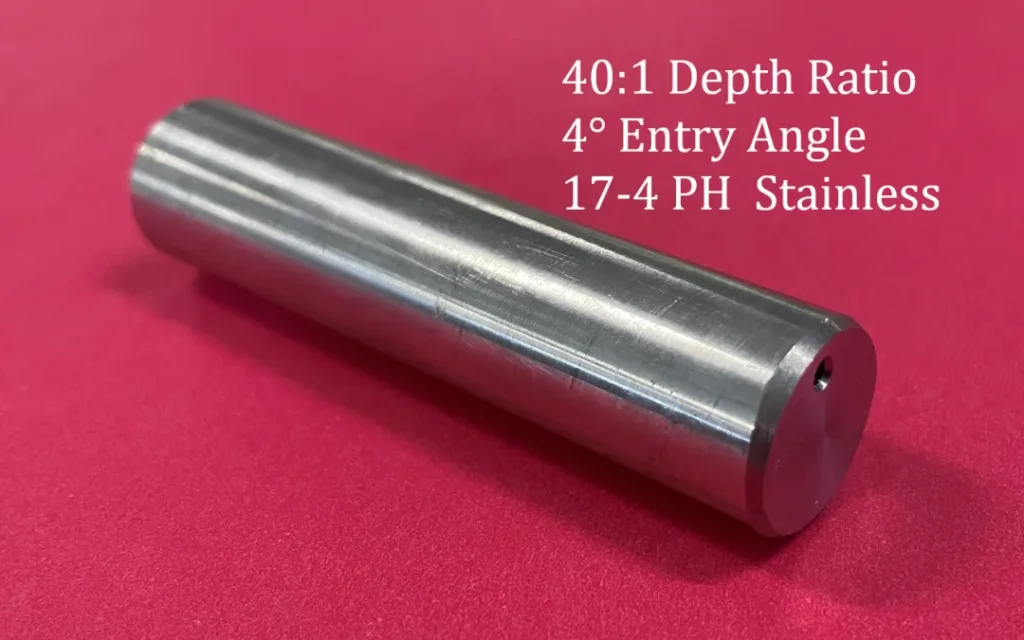A test coupon for a part with a drilled hole at a 40:1 dept-to-diameter ratio at a 4 degree angled entry.