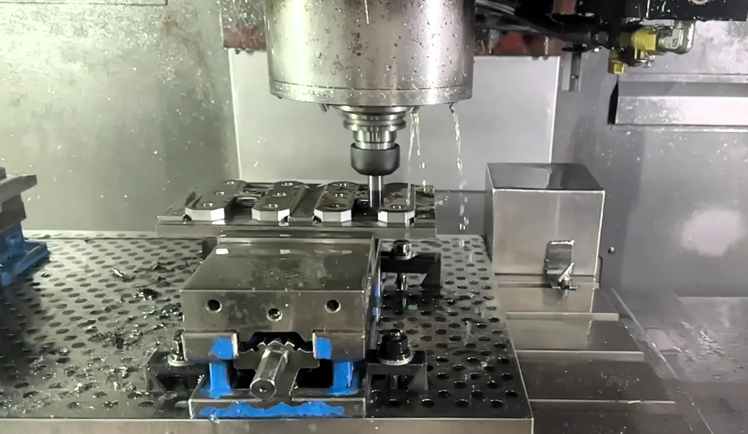 CNC mill chamfering prismatic parts.